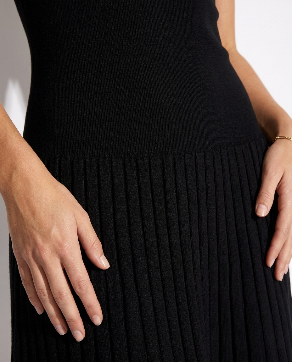 Corinne — Black Pleated Drop-Waist Mini Dress, fabric detail